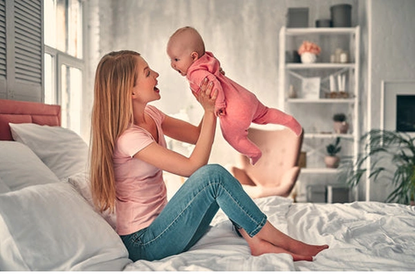 A Woman Playing with a Child