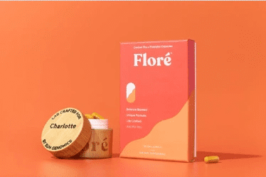 Custom pre and probiotics from Floré by Sun Genomics on bright orange background with custom engraved container