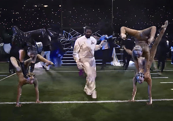 Contortionists wearing Object & Dawn head bands during Usher's halftime performance at the Super Bowl