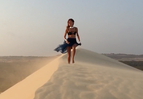Saida Mouradova running atop the Red Sand Dunes of Mui Ne Vietnam. 