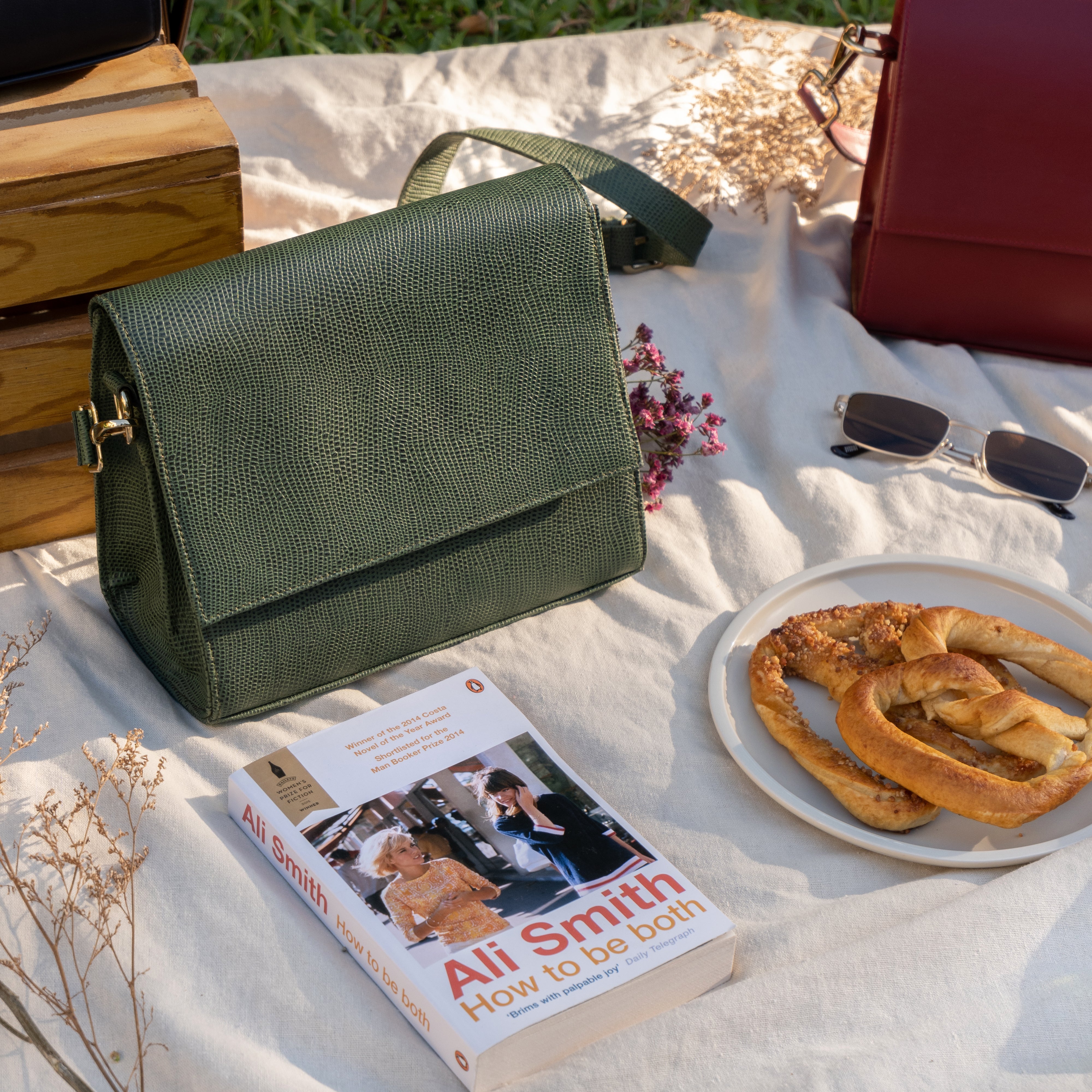 sage structure flap crossbody sling bag in a picnic mat