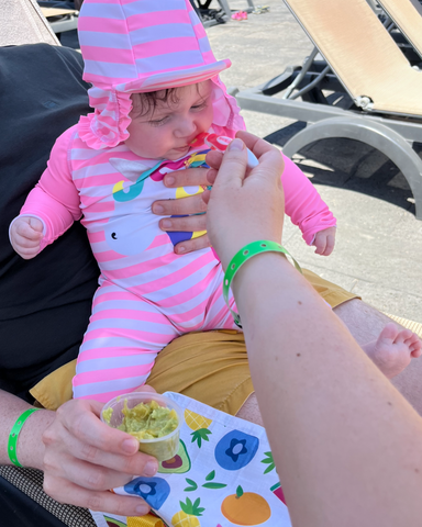 Feeding a baby at the beach