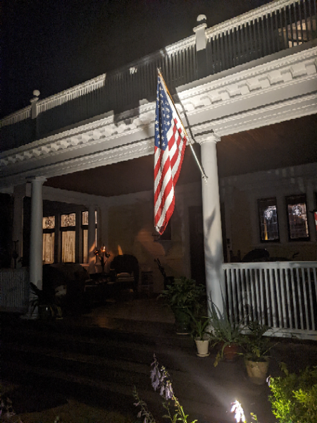 American Flag on the front porch of our home and WeatherWool headquarters, Fourth of July, 2022, before first light