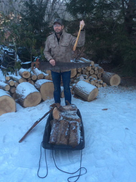 WeatherWool Advisor Mike Dean bucking and splitting firewood with hand tools in his MidWeight ShirtJac in temperature of about 18F/-8C