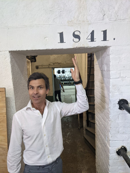 Jacob Long, proprietor of American Woolen Company, with a “cornerstone” of the original plant. American Woolen is absolutely key in the production of WeatherWool Fabric.