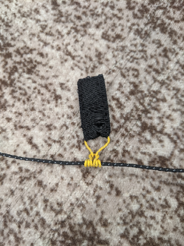 WeatherWool is exploring the use of a Prusik Knot to replace the typical plastic cord locks.