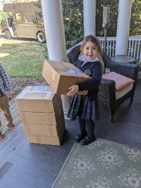 Zabz (Alex's daughter Isabelle) is a hard worker and loves to help however she can. When the UPS truck backs into the driveway, there are lots of packages going out. As soon as Zabz saw Alex and I ferrying packages out to the porch, she pitched in without being asked. Zabz can carry two Anorak-boxes at once!