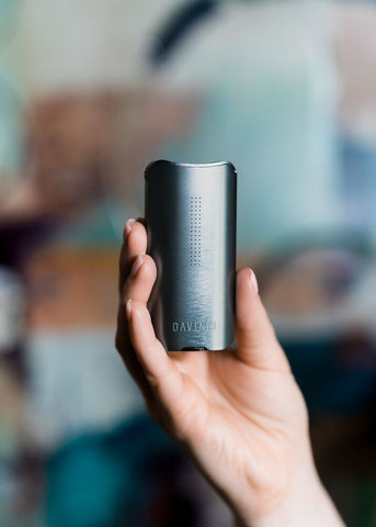 Clean, grey DaVinci IQ2 Vaporizer in hand