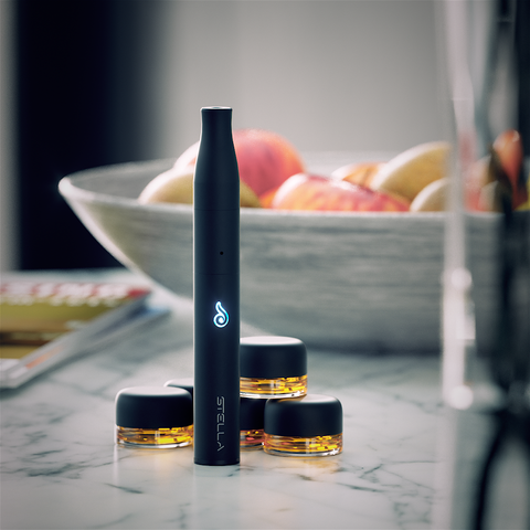 Dr. Dabber Stella Concentrate Vaporizer on table with material 