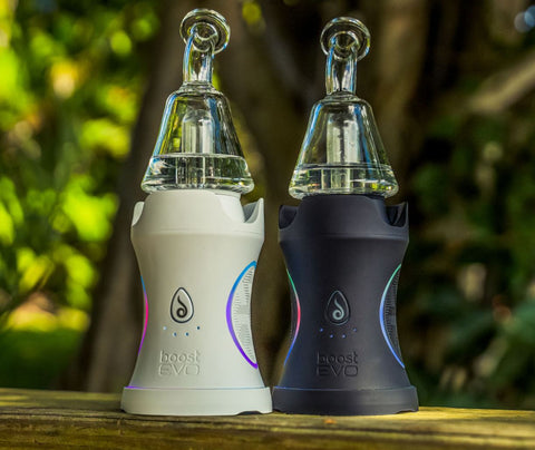 a white Dr. Dabber Boost EVO and a black Dr. Dabber Boost EVO