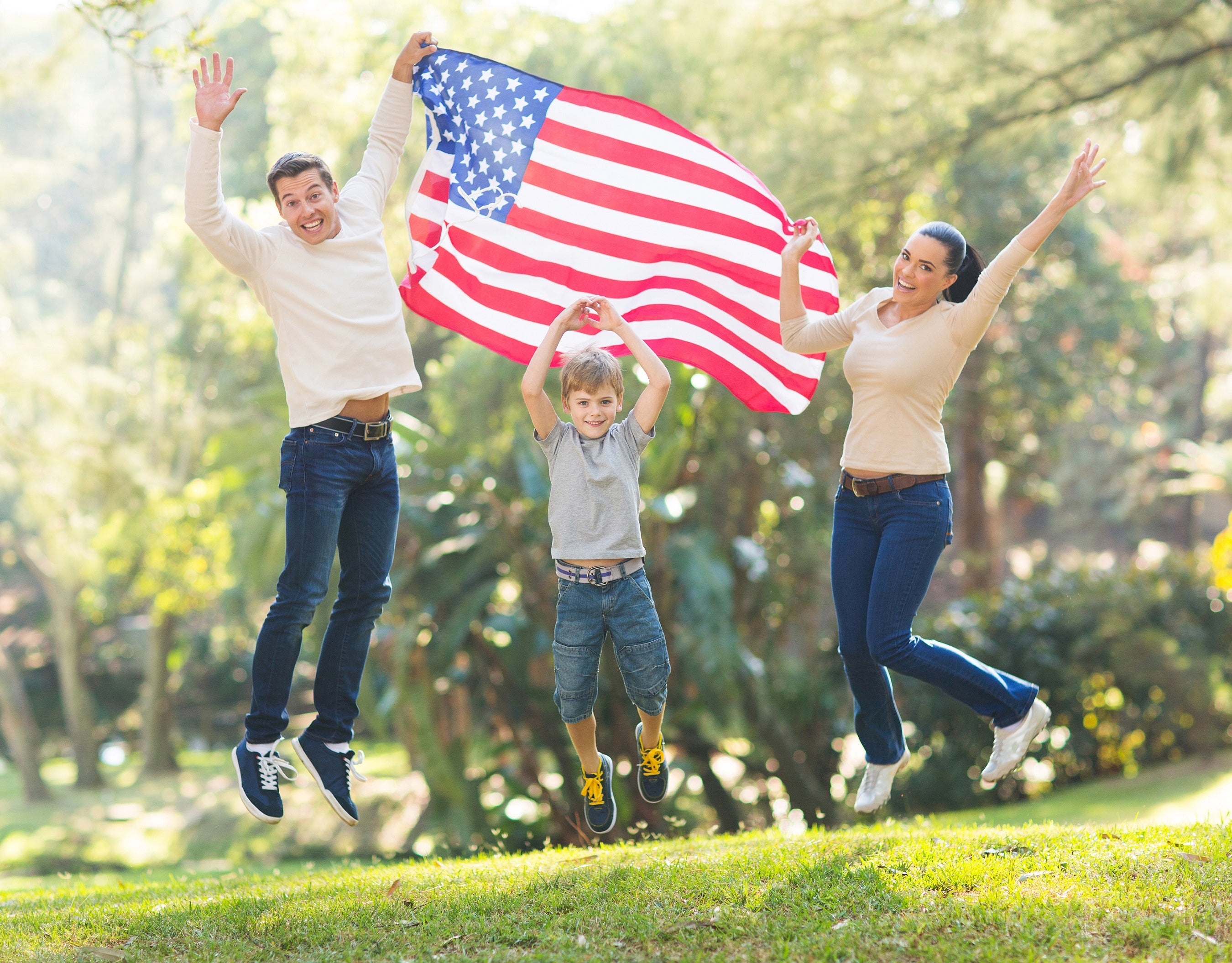family holding american flag - small