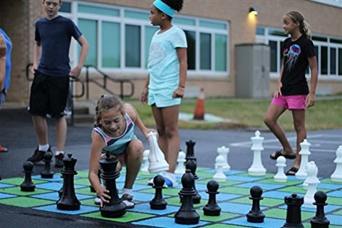 Kids Playing with a MegaChess 16 Inch Plastic Giant Chess Set