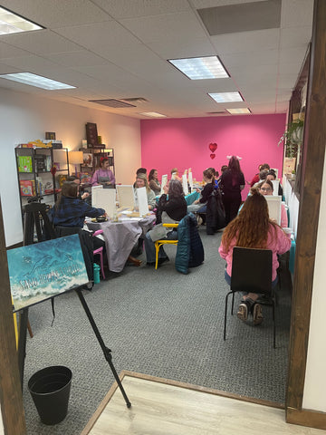 Photo of a group during a paint night activity