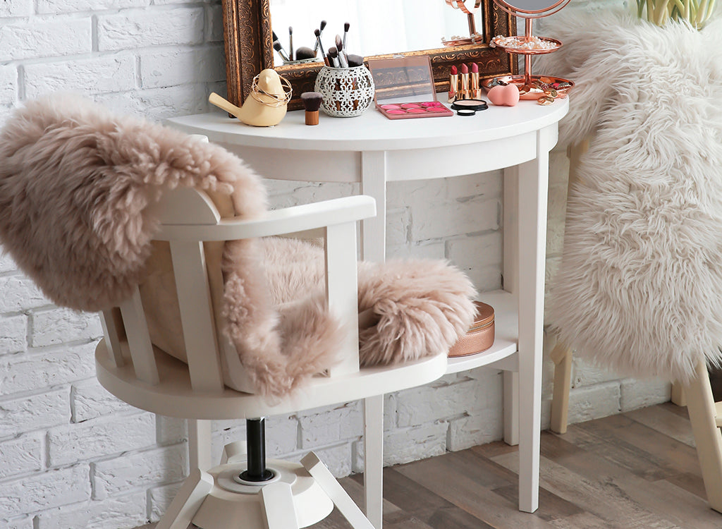 Closeup of chair with fur throw