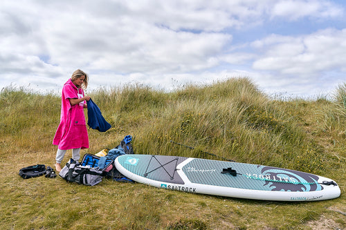 Woman getting ready to paddleboard