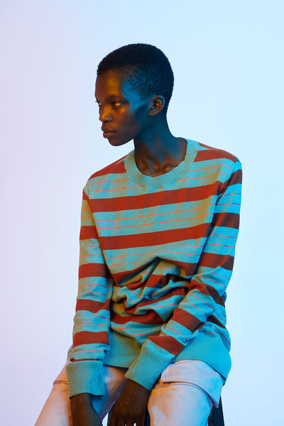 Model seated wearing Sies Marjan coralie striped sweater. Portrait series by Blommers and Schumm for SS '18 Collection
