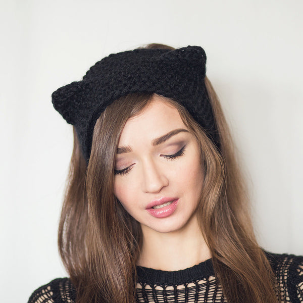 black cat ear warmers worn by woman kittysensations