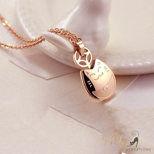 rose gold cat necklace on white background