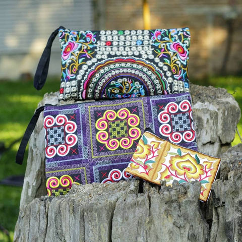 a variety of artisan made embroidered bags by Sabai Jai showcasing the wide array of style, sizes, color, etc