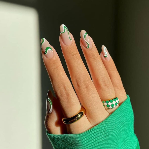 Green nails with swirl designs