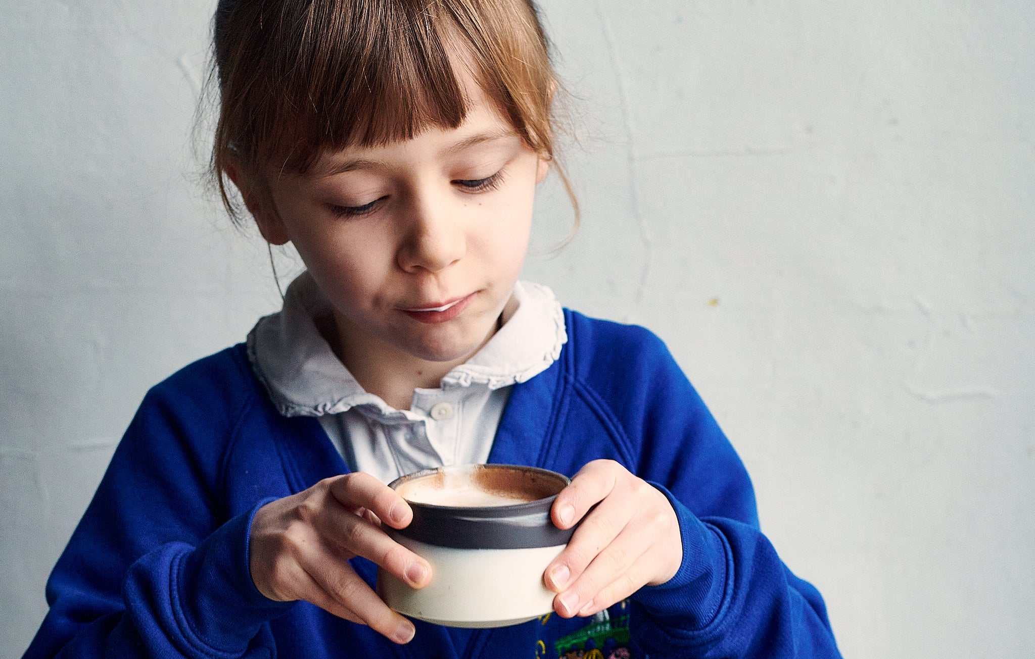 child drinking chocolate