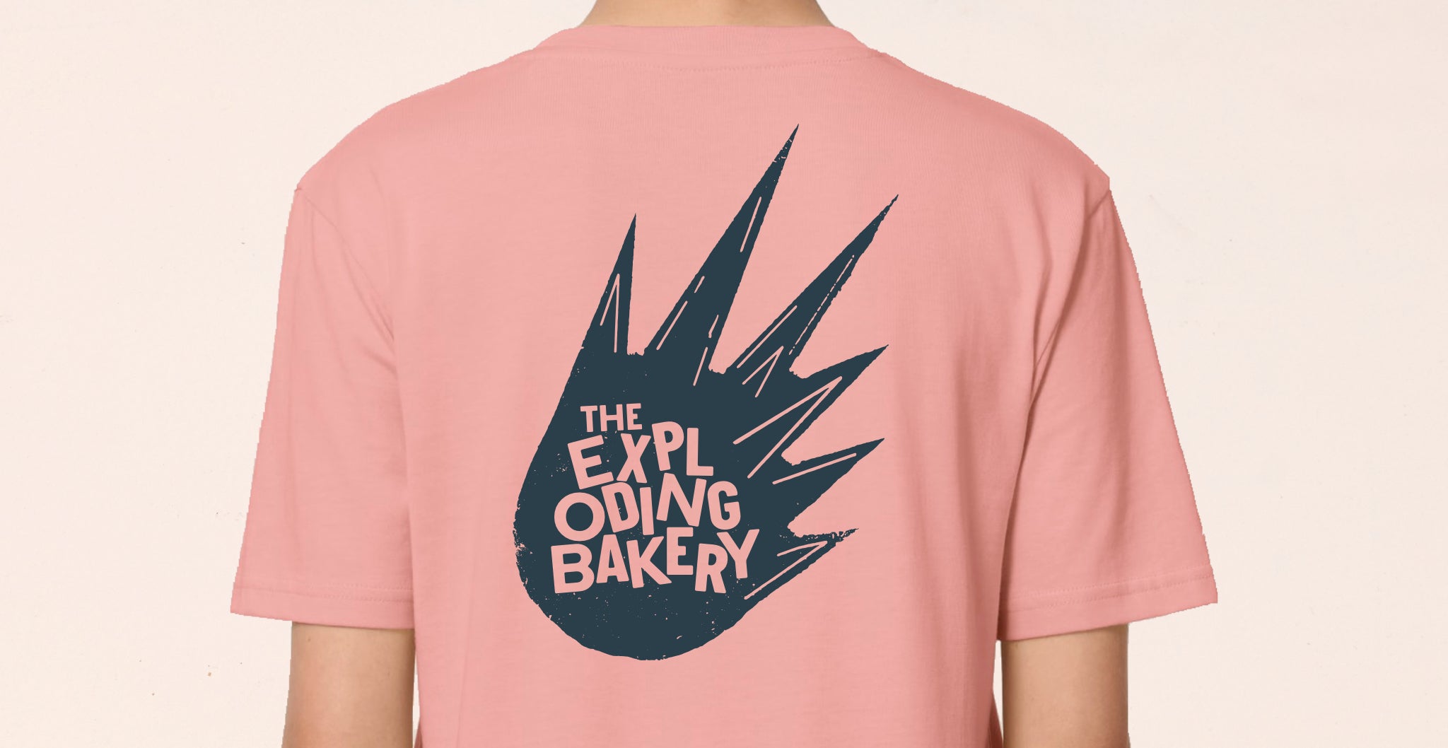 back of pink t-shirt with exploding bakery design print on back