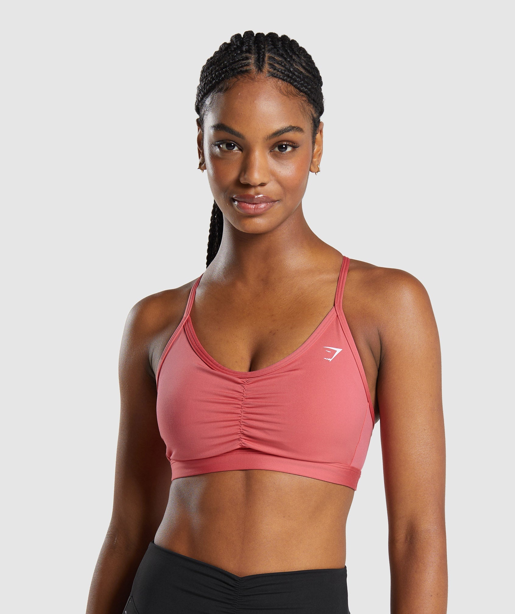 Ruched Sports Bra dans Sunbaked Pinkest en rupture de stock