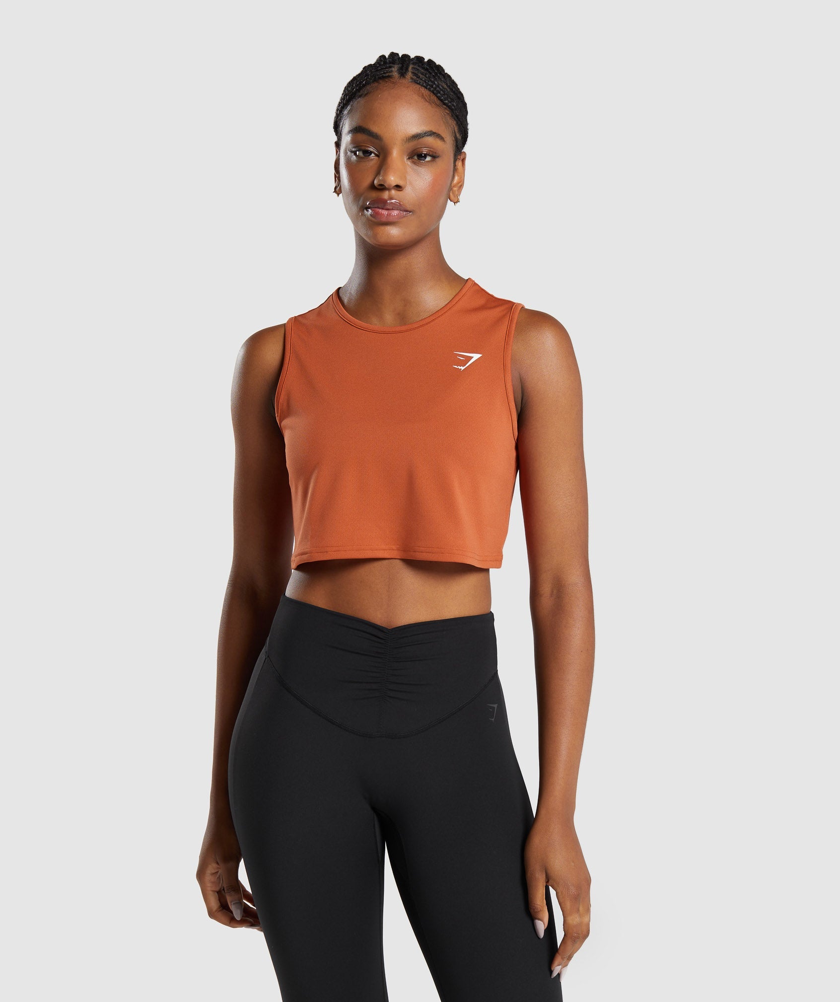 Training Crop Tank dans Rust Orangeest en rupture de stock