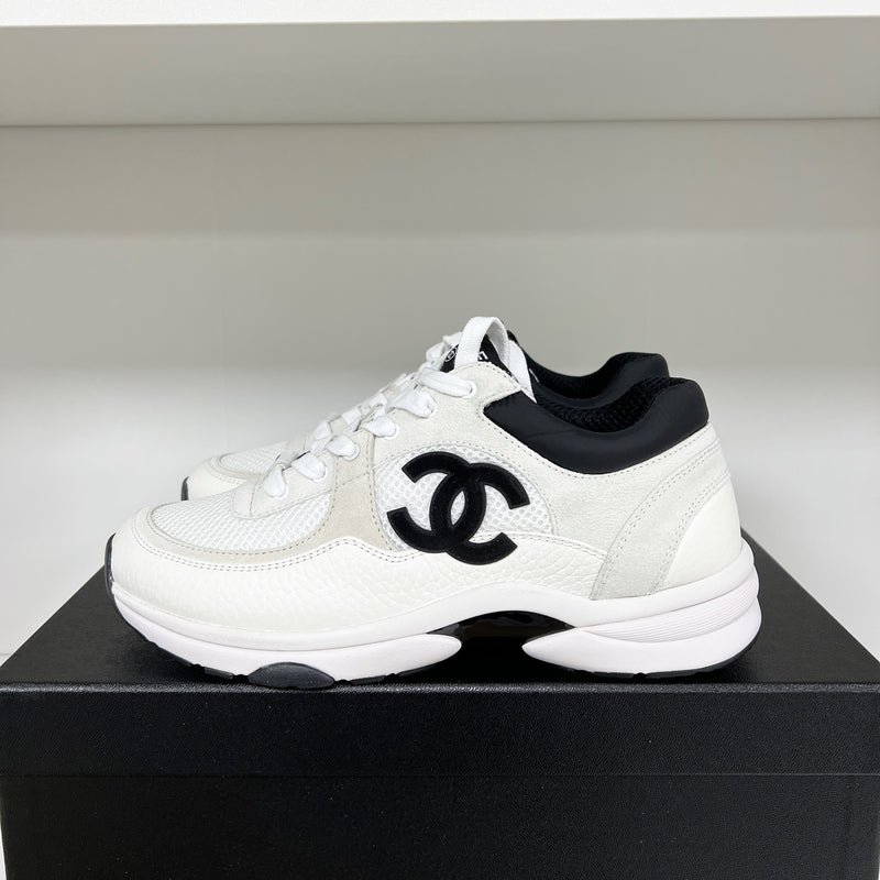 Chanel CC Logo Runner Sneaker White/Black 2021 – The Luxury Shopper