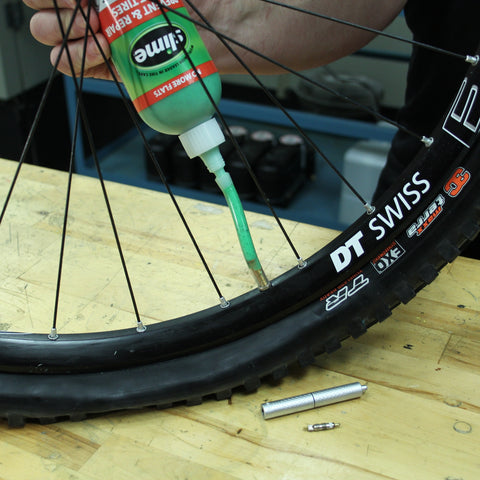 Injecting Slime into Bicycle Tire