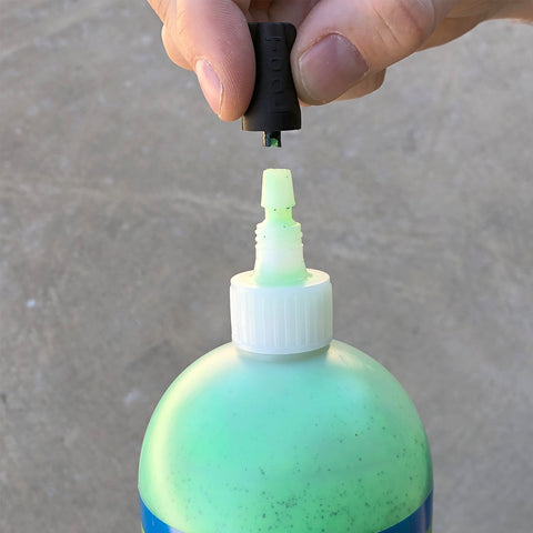 Valve core tool in top of Slime sealant bottle