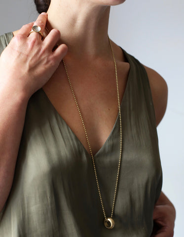 Model shot of woman wearing the Delilah Pendant necklace 