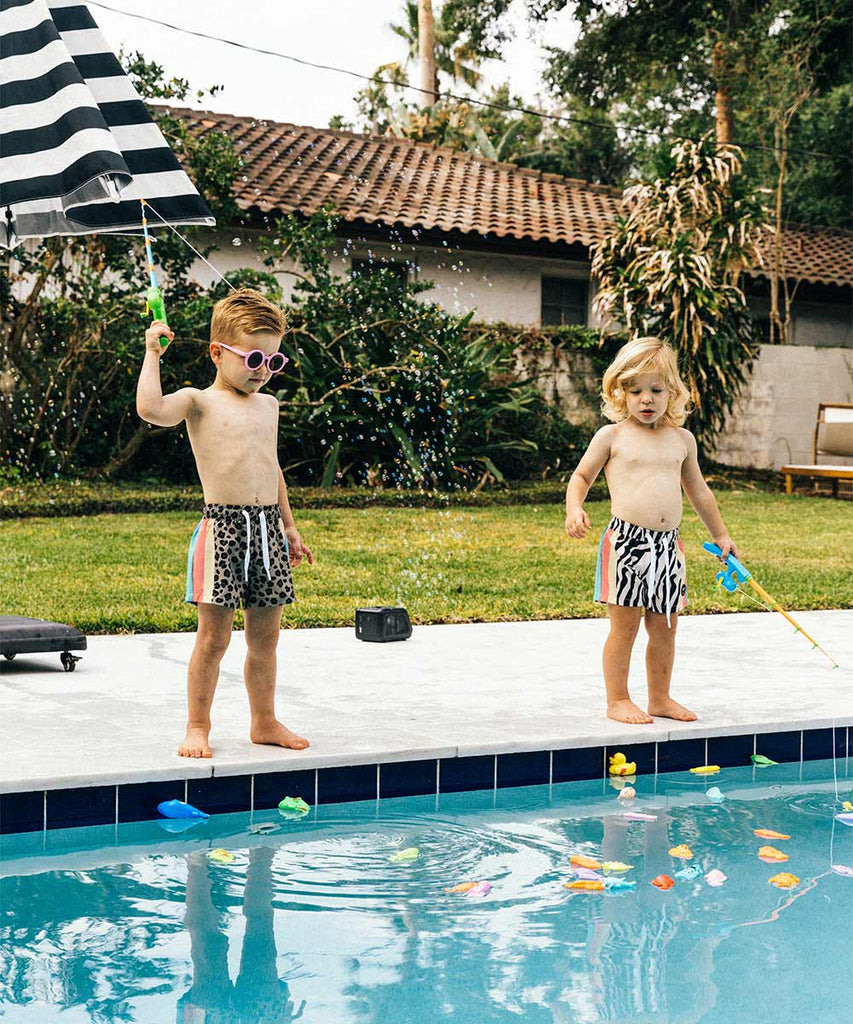 kids fishing in a pool