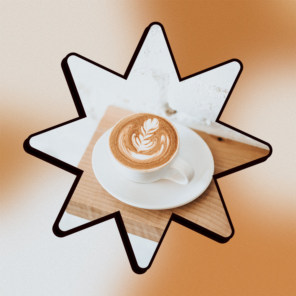 A honey latte on a saucer on a shelf in a star shape on a mesh gradient background.