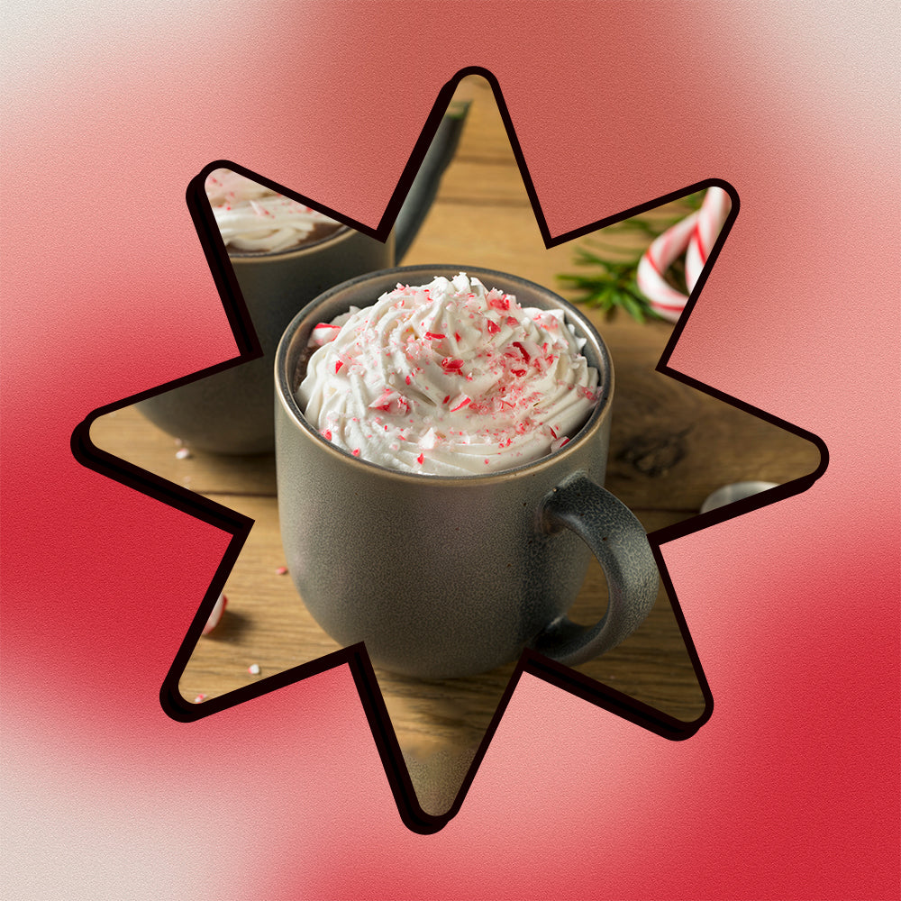 A peppermint mocha in a star shape on a mesh gradient background.