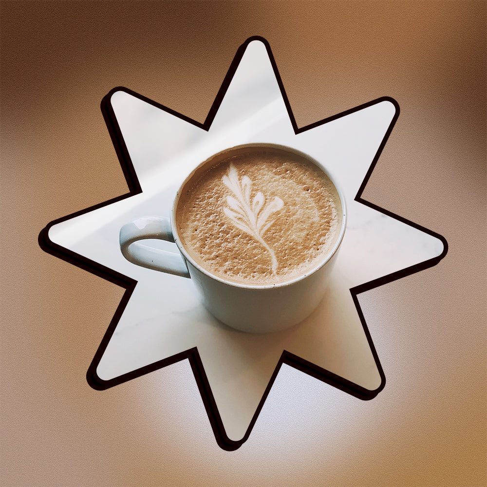 A salted caramel mocha on a marble surface in a star shape on a mesh gradient background.