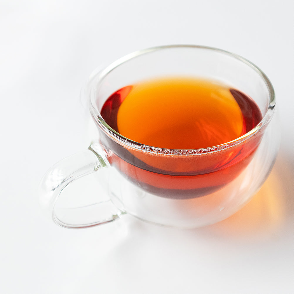 A double-walled cup of rooibos.