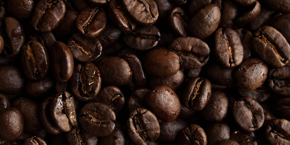Bed of Kenya-AA coffee beans.
