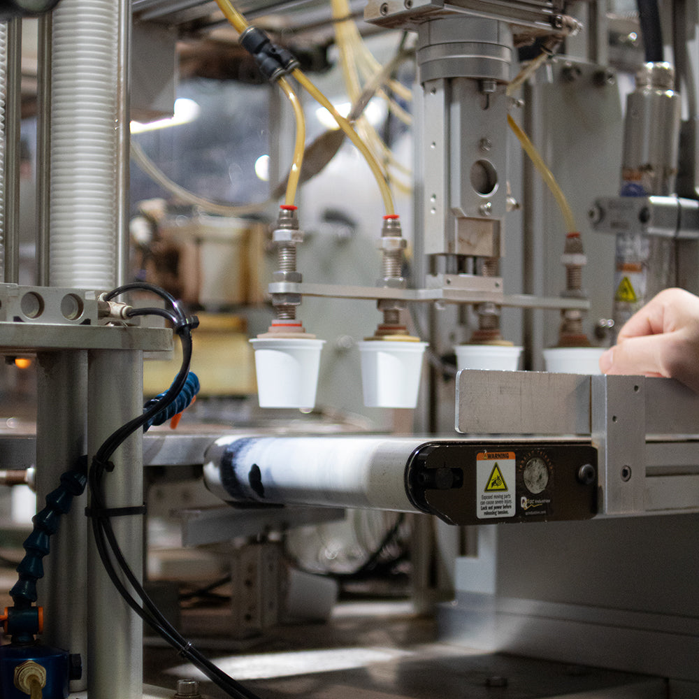 Fresh coffee pods coming off the machine.