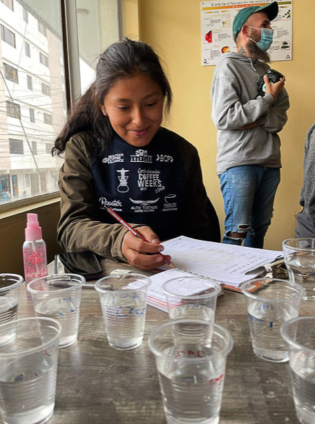 Bolivian coffee producer Yulissa Chambi evaluating.