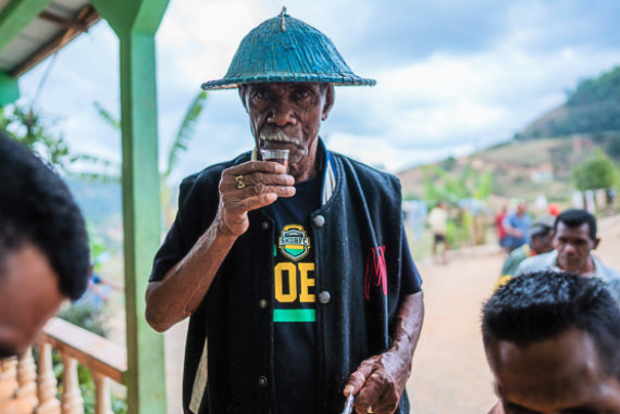 Timorese coffee producer sampling a coffee.