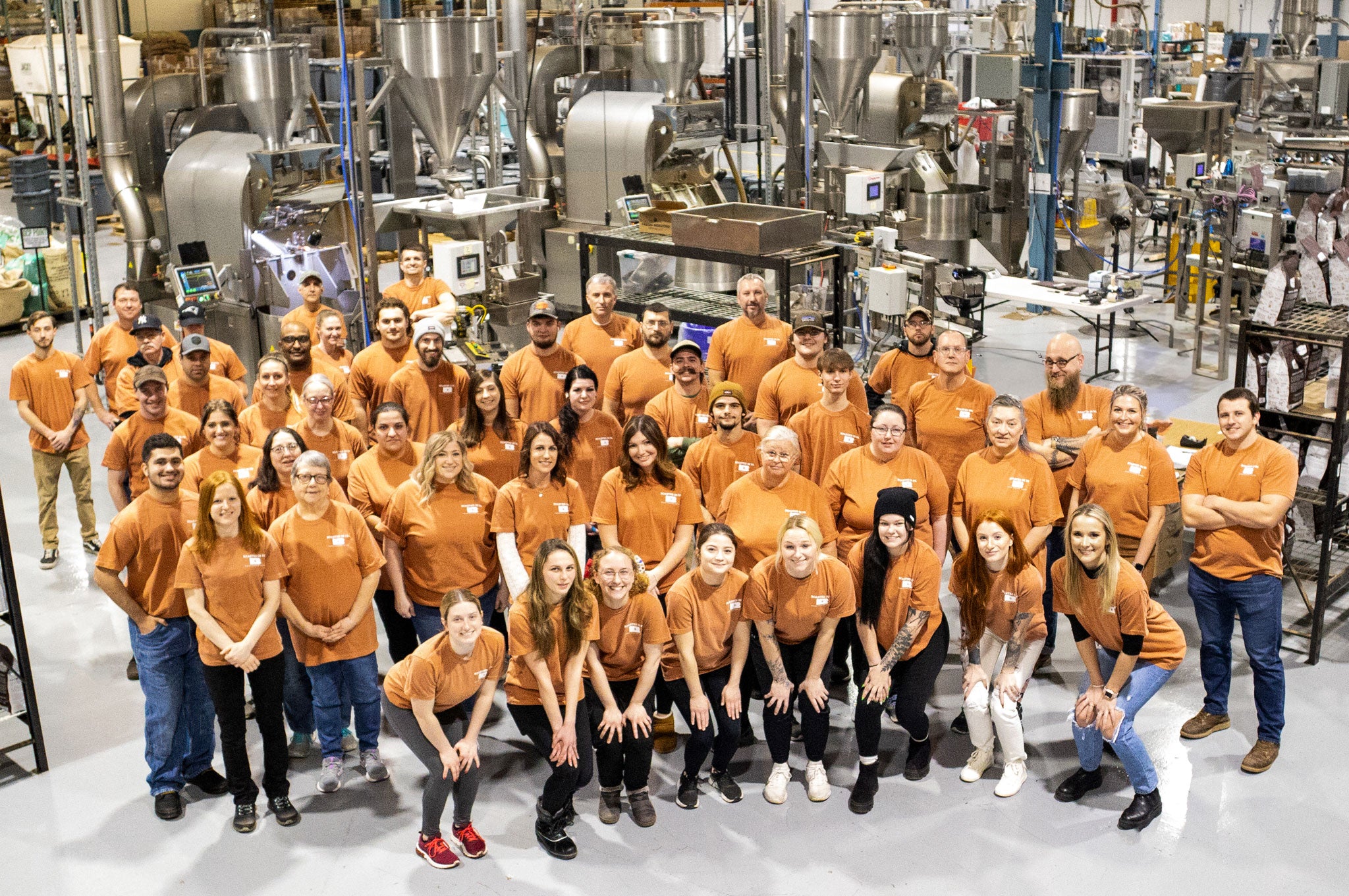 A photo of the Fresh Roasted Coffee team in front of our Loring Smart Roasters.