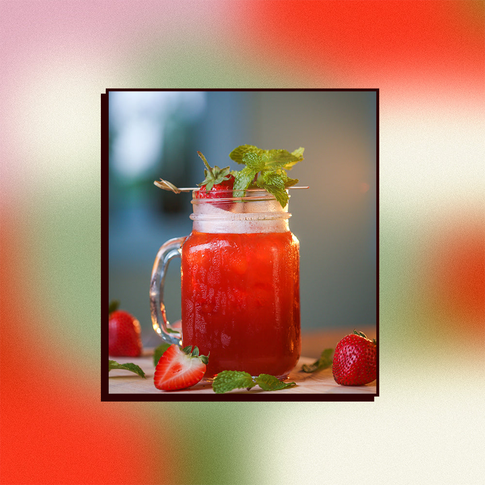 Image of a hibiscus iced tea with a strawberry garnish on a mesh gradient background.