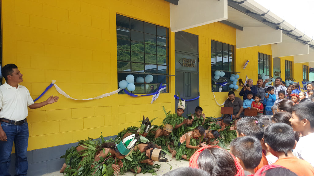 children celebrate the dedication of the new school with a traditional ceremony