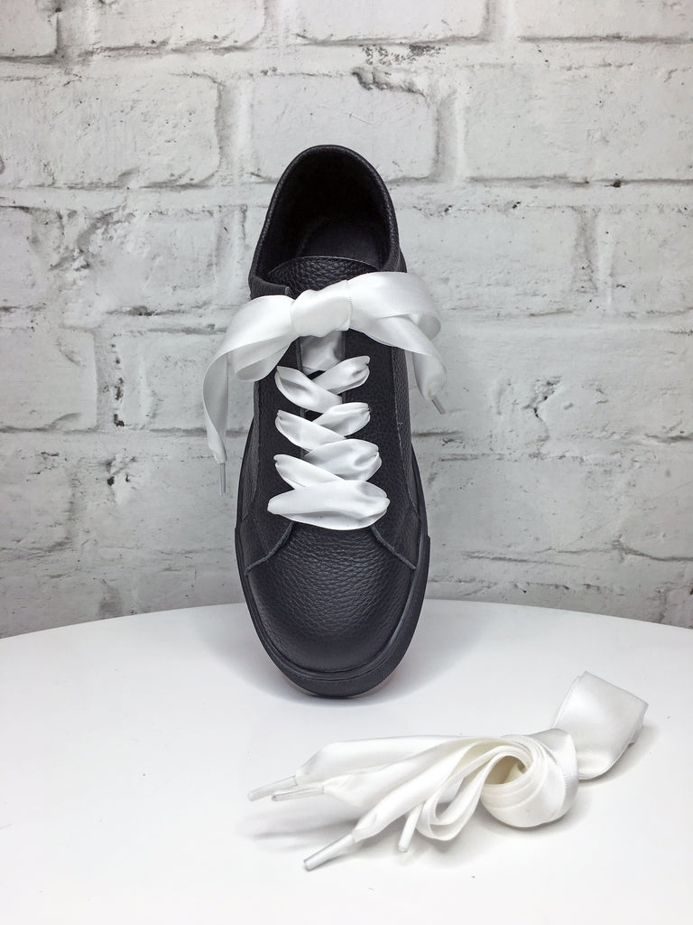 white ribbon sneakers
