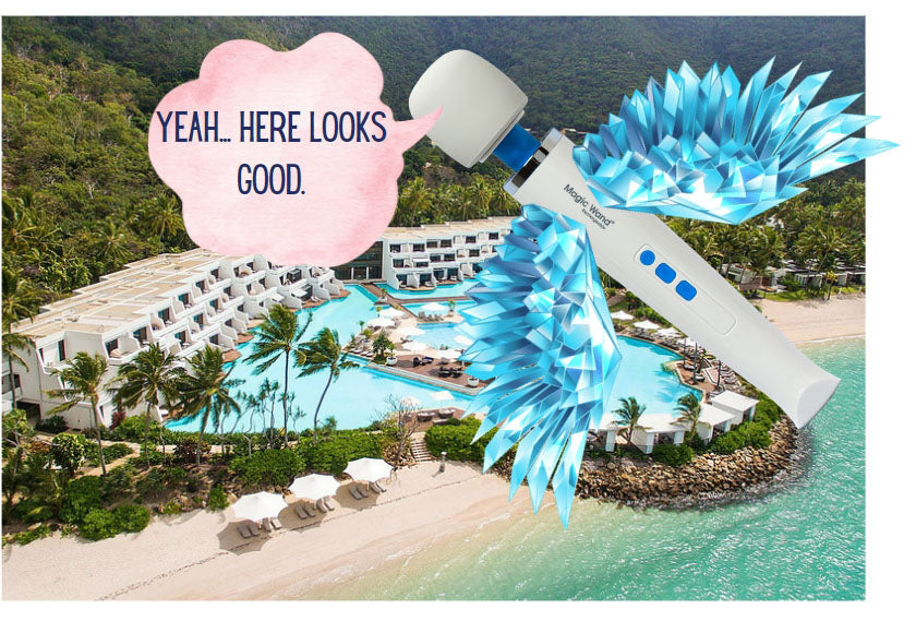 Fun picture of a Hitachi Magic Wand massager with wings flying over a tropical island holiday resort.