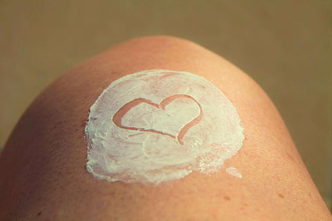 skin with lotion formed heart