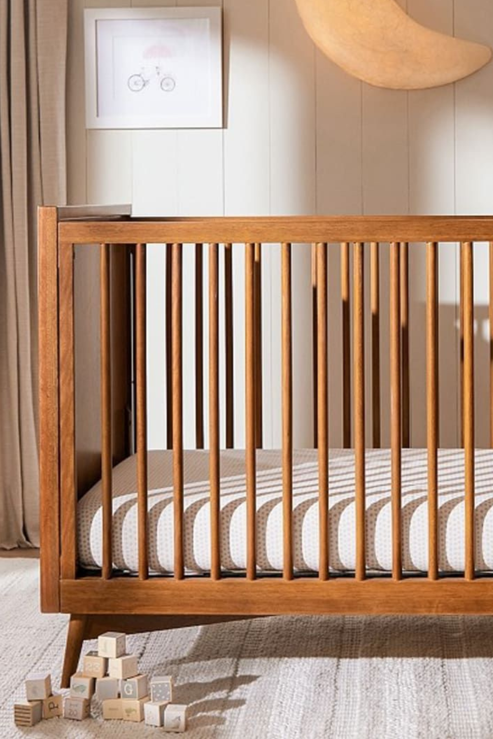 Explore our non-toxic nursery crib, designed for your baby's safety and comfort, reminiscent of West Elm's timeless style