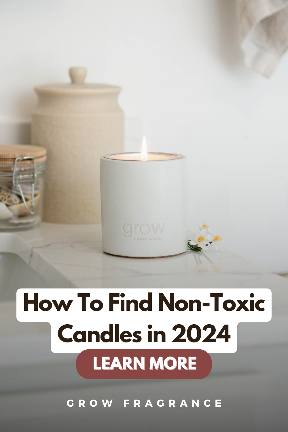 Lit non-toxic candle in a bathroom setting with text 'How to Find Non-Toxic Candles in 2024' on the label, demonstrating safe candle choices