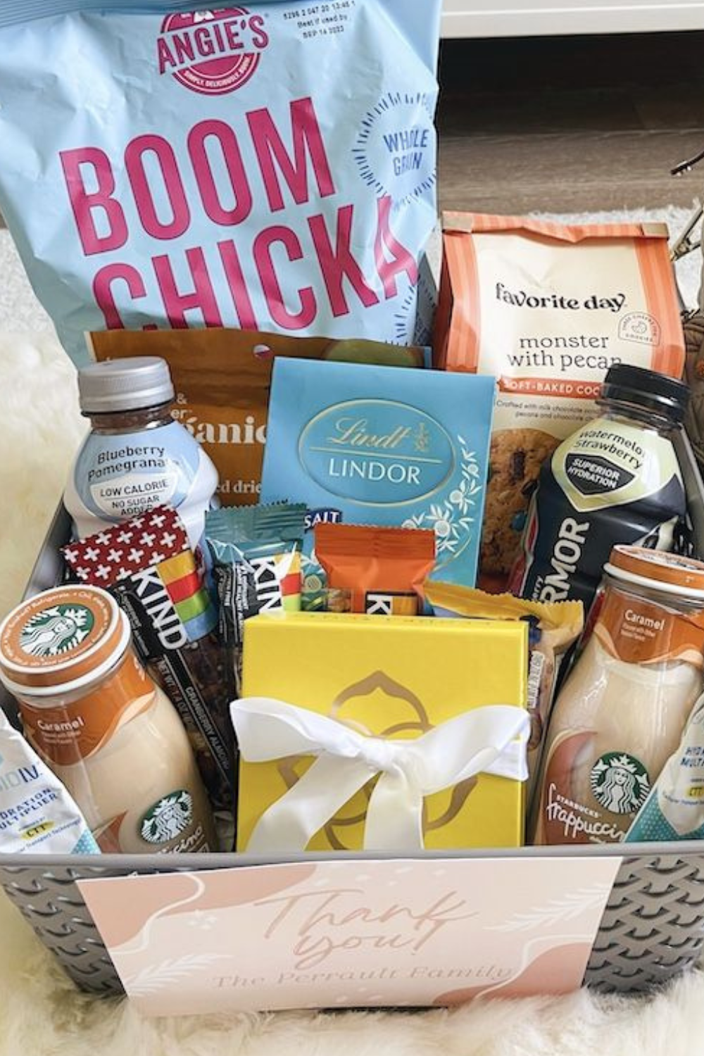 Explore essentials for crafting the perfect Postpartum Basket - snacks, protein treats, and a reusable water bottle. Ideal gifts for new mothers seeking comfort and care.